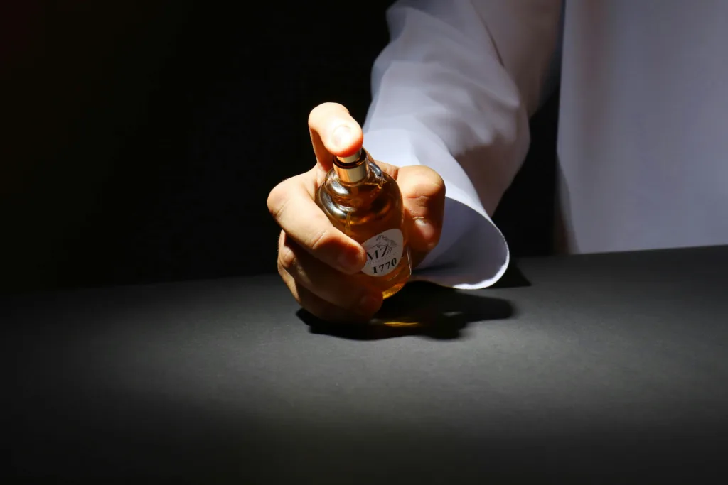 A Person Holding a Perfume